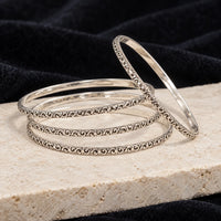 Antique engraved silver bangles, styled