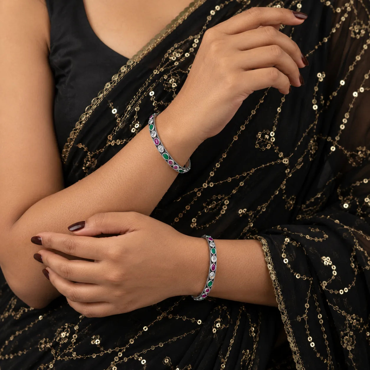 Classic oval silver bangles worn with a saree