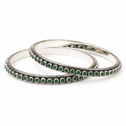 Classic round silver bangles with green stones