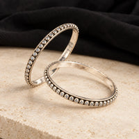 Classic round white stone silver bangles, styled