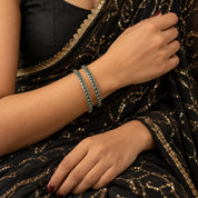 Classic round green stone silver bangles worn on the wrist