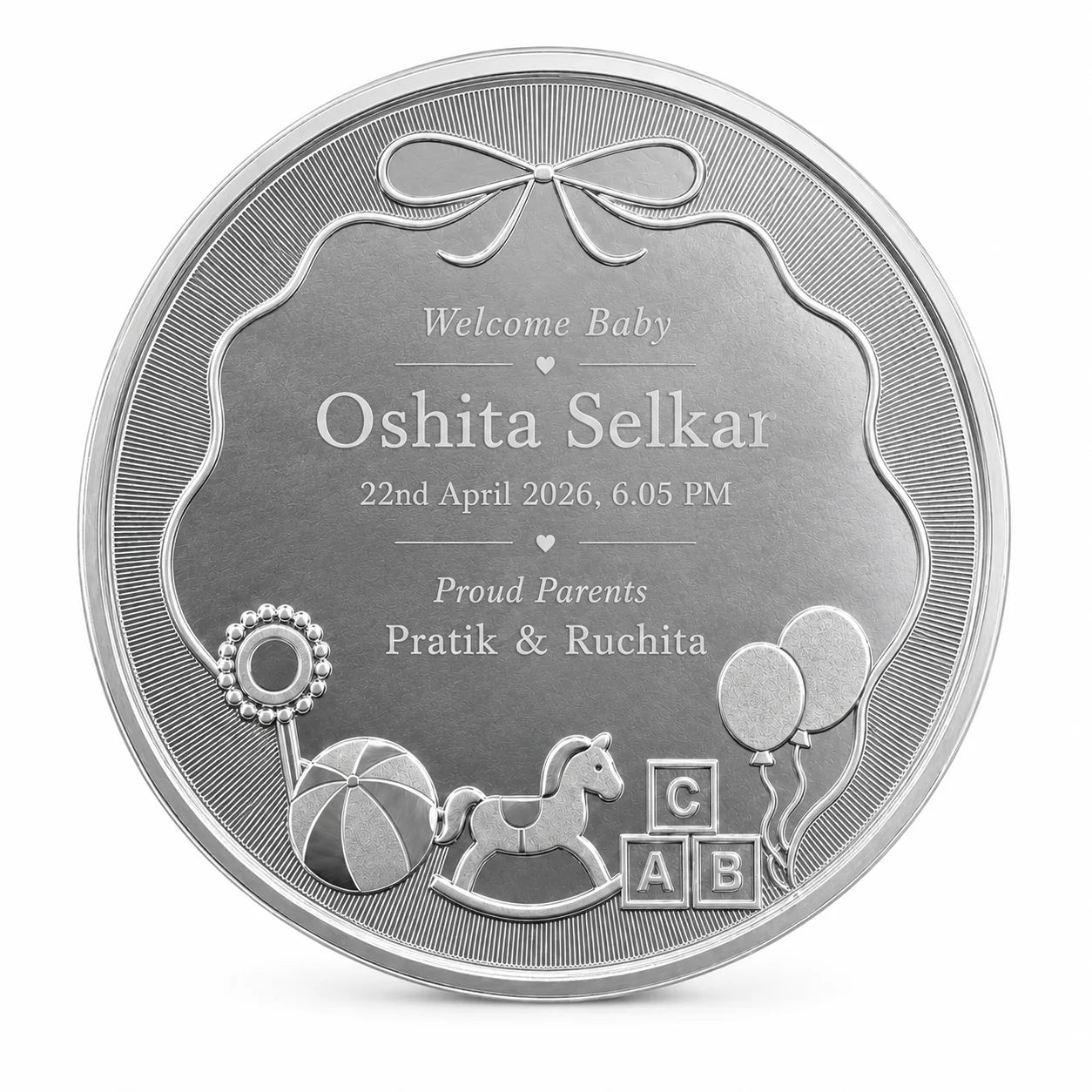 Personalised silver baby coin engraved with baby name, birth date and parents' names by Adorn Silver