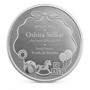 Personalised silver baby coin engraved with baby name, birth date and parents' names by Adorn Silver