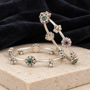Floral motif dual stone silver bangles, styled