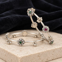 Floral motif dual stone silver bangles, styled