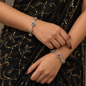 Floral motif silver bangles, detail