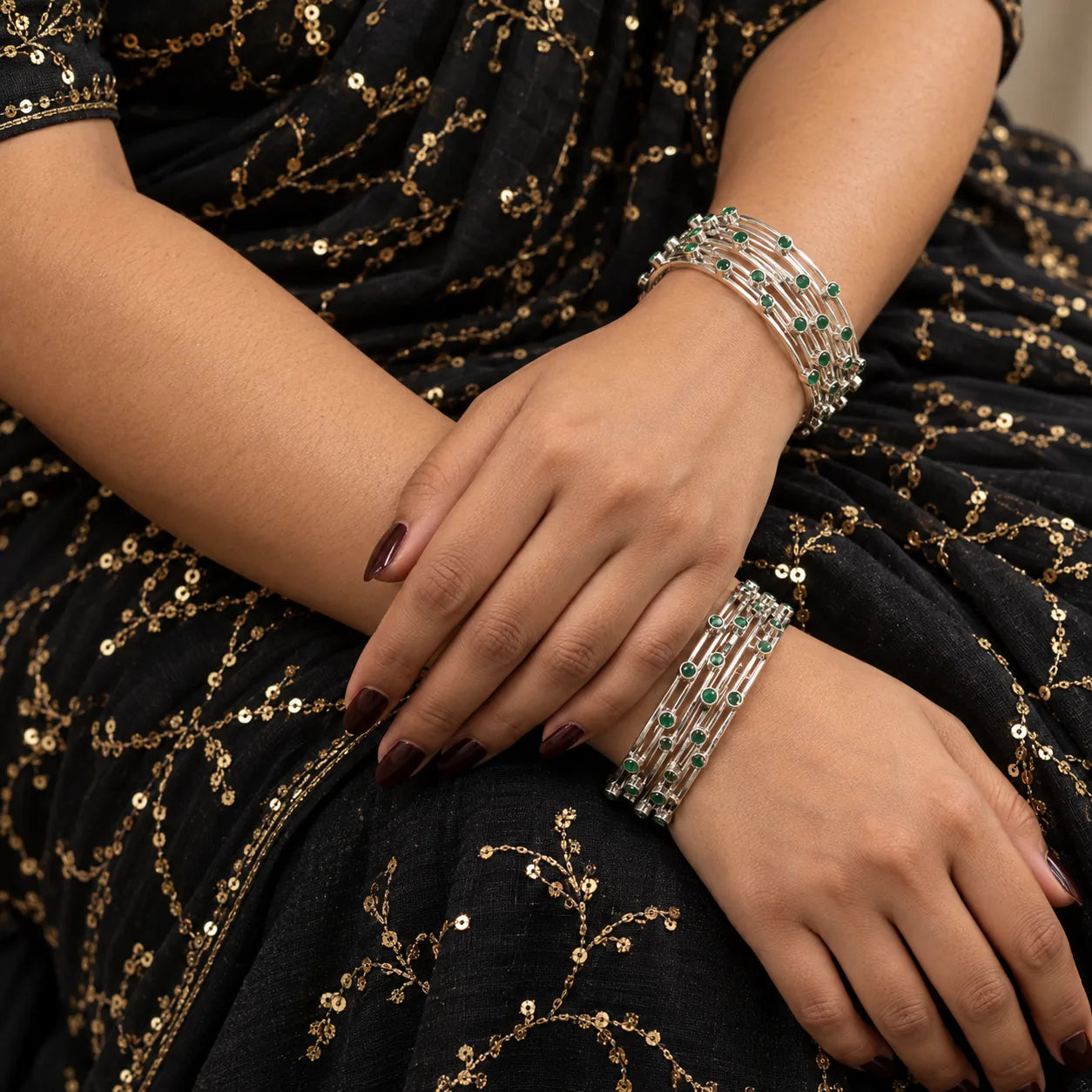 Multi-row silver bangle worn on the wrist
