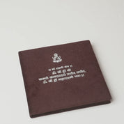 Unboxing the Blessings in Silver Lakshmi edition: velvet mantra folder opened to reveal the 5 gm 999 silver Lakshmi coin