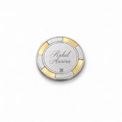 Back of the silver poker chip engraved with a name