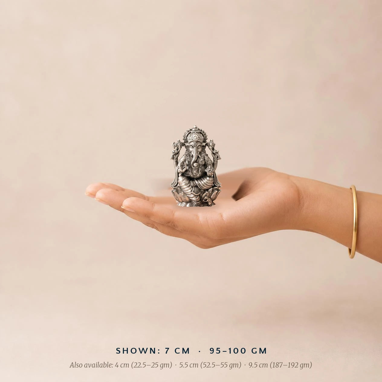 Silver Lord Ganesh idol, 7 cm and 95–100 gm, held in the palm to show scale