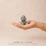Silver Lord Ganesh idol, 7 cm and 95–100 gm, held in the palm to show scale