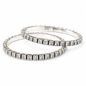 Square-set silver bangles with white stones